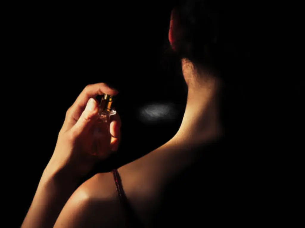 spraying perfume