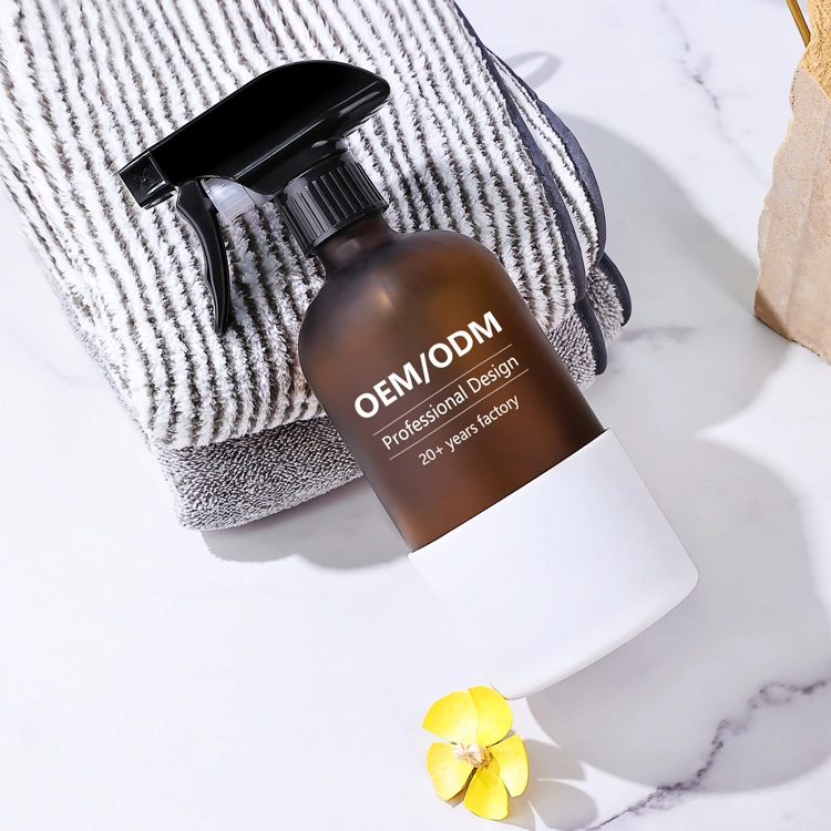 Glass trigger spray bottle with a silicone sleeve