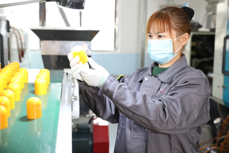 Technician testing the durability of a color coating on cosmetic bottles