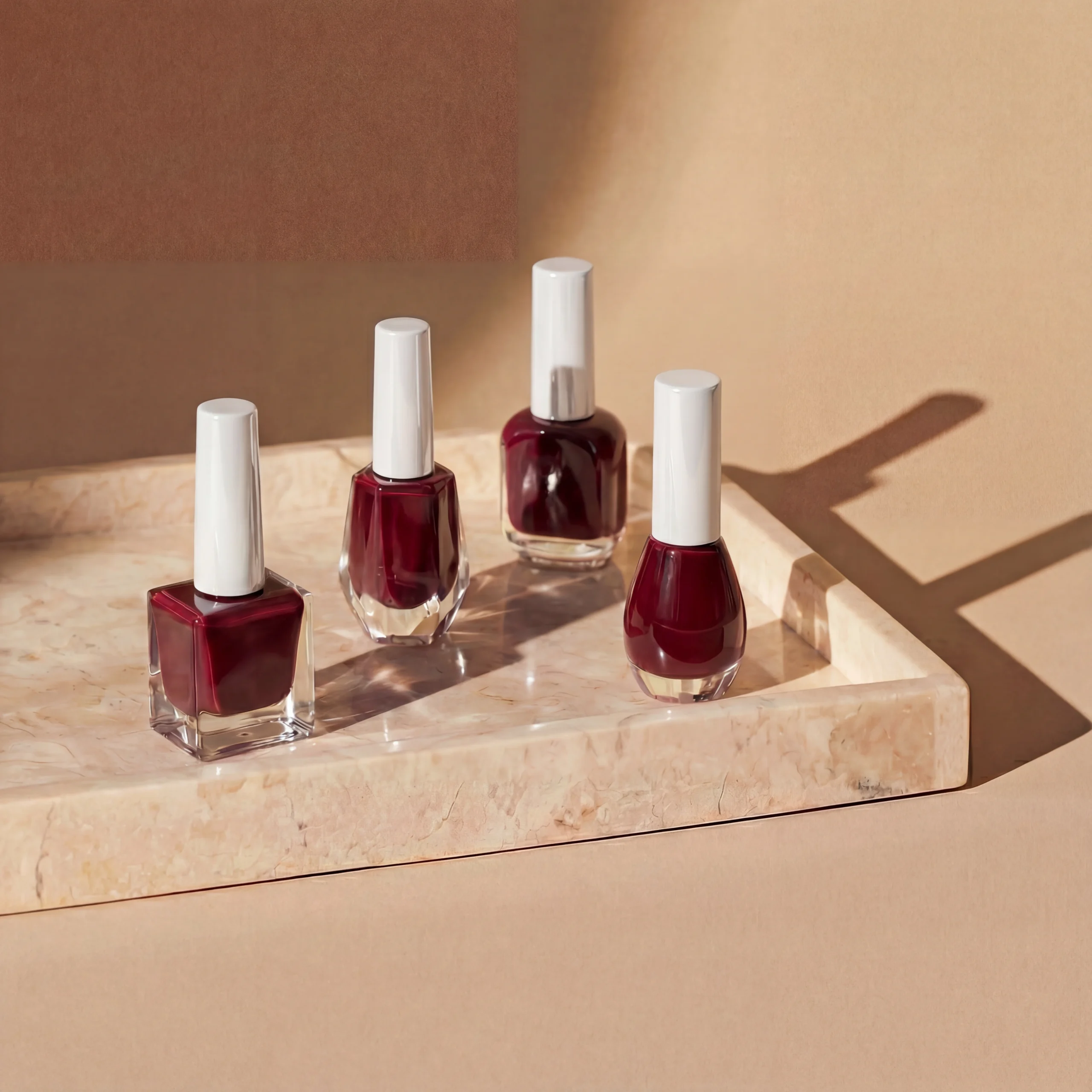 nail_polish_wine_red_glossy_white_caps_4k