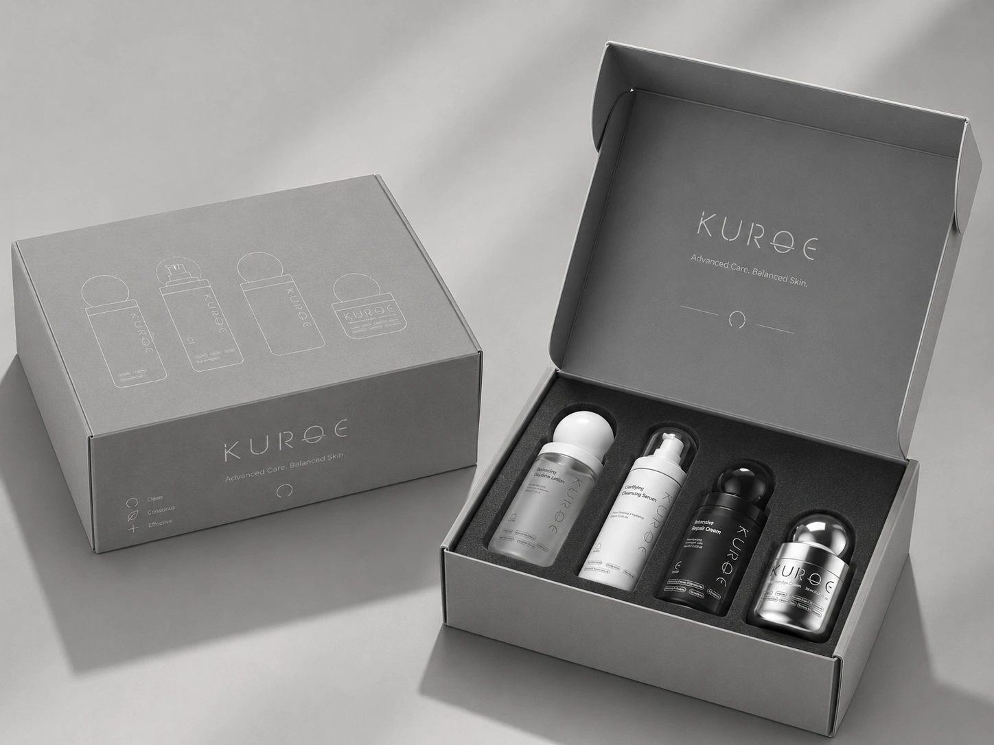 KUROE gift set — open rigid box with all four bottles and cartons reading Advanced Care Balanced Skin