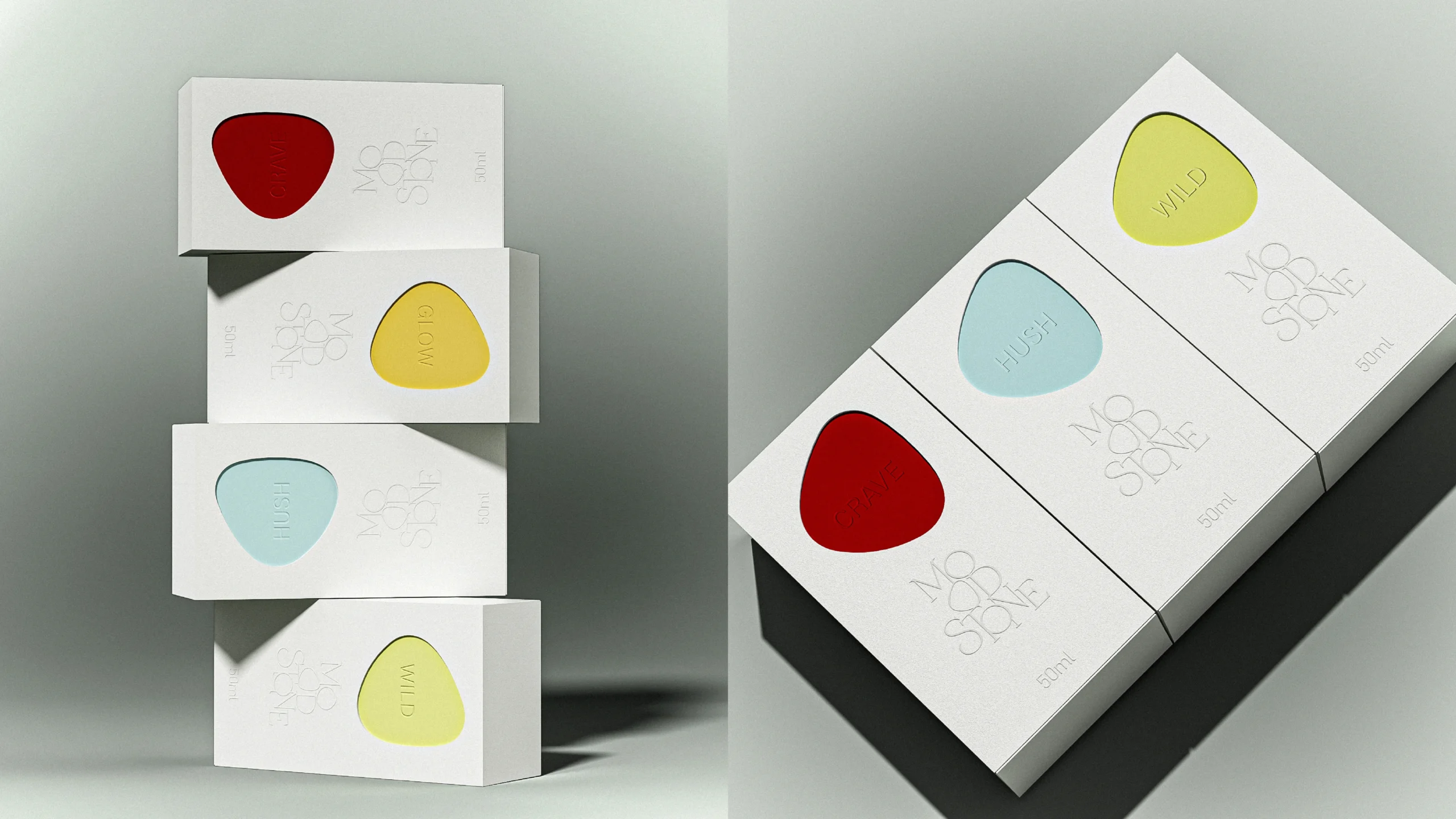 four white 50 ml MOOD//STONE perfume cartons with red CRAVE, yellow GLOW, blue HUSH and green WILD pebble graphics