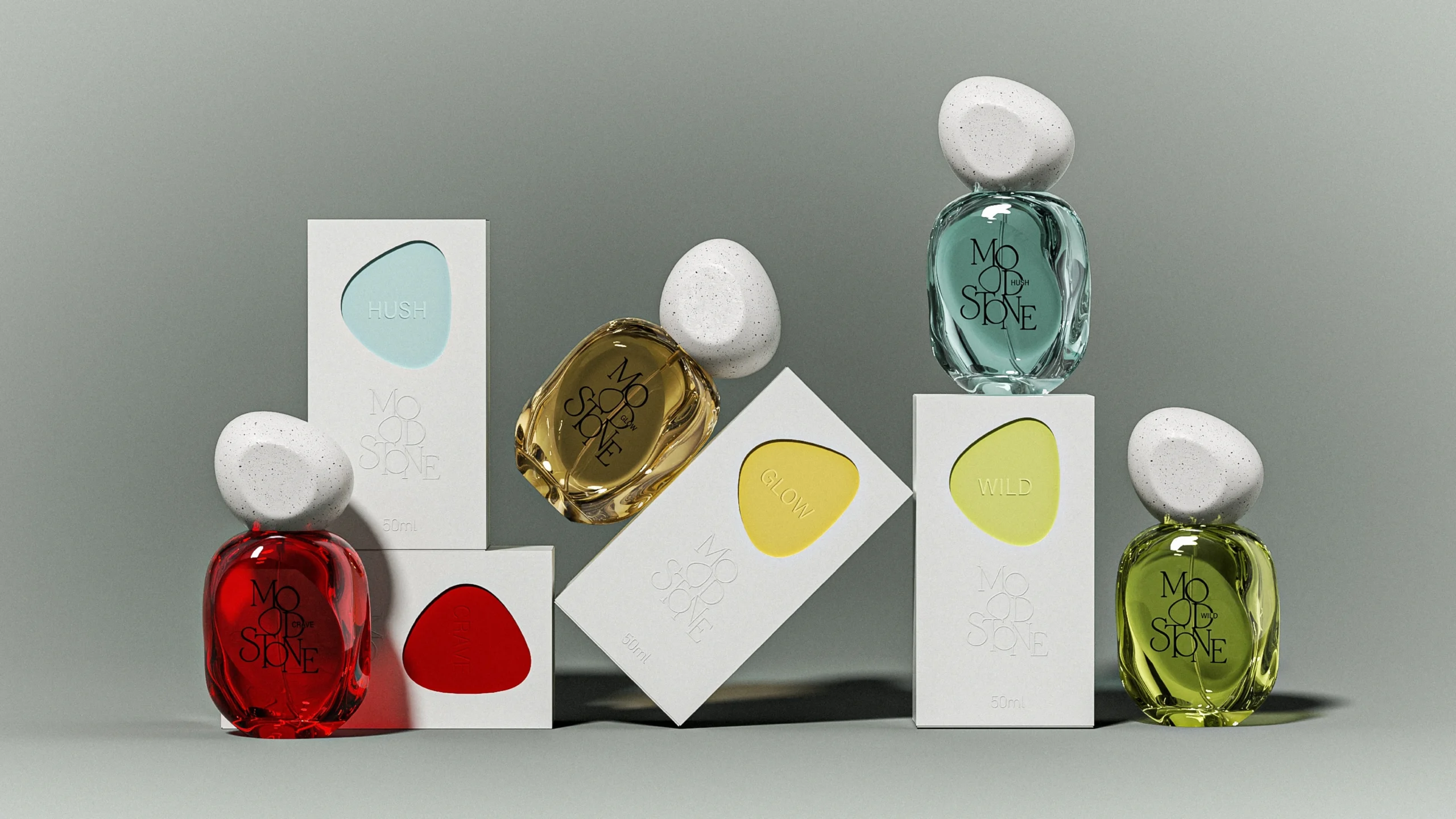 four MOOD//STONE 50 ml pebble perfume bottles displayed with white color-coded cartons for CRAVE, GLOW, HUSH and WILD