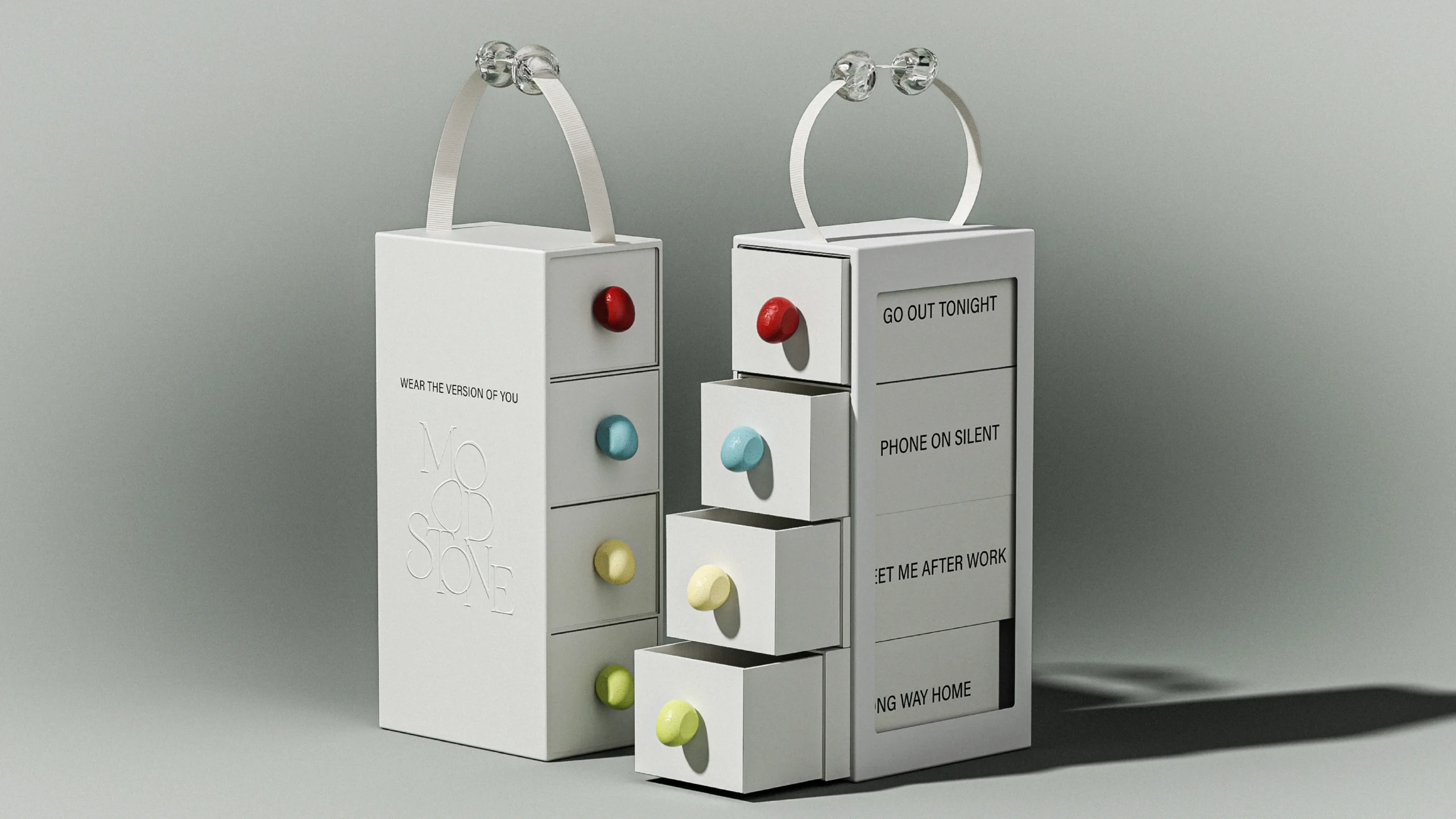 white MOOD//STONE fragrance gift tower with ribbon handles, four drawers, colored pebble pulls and four occasion phrases