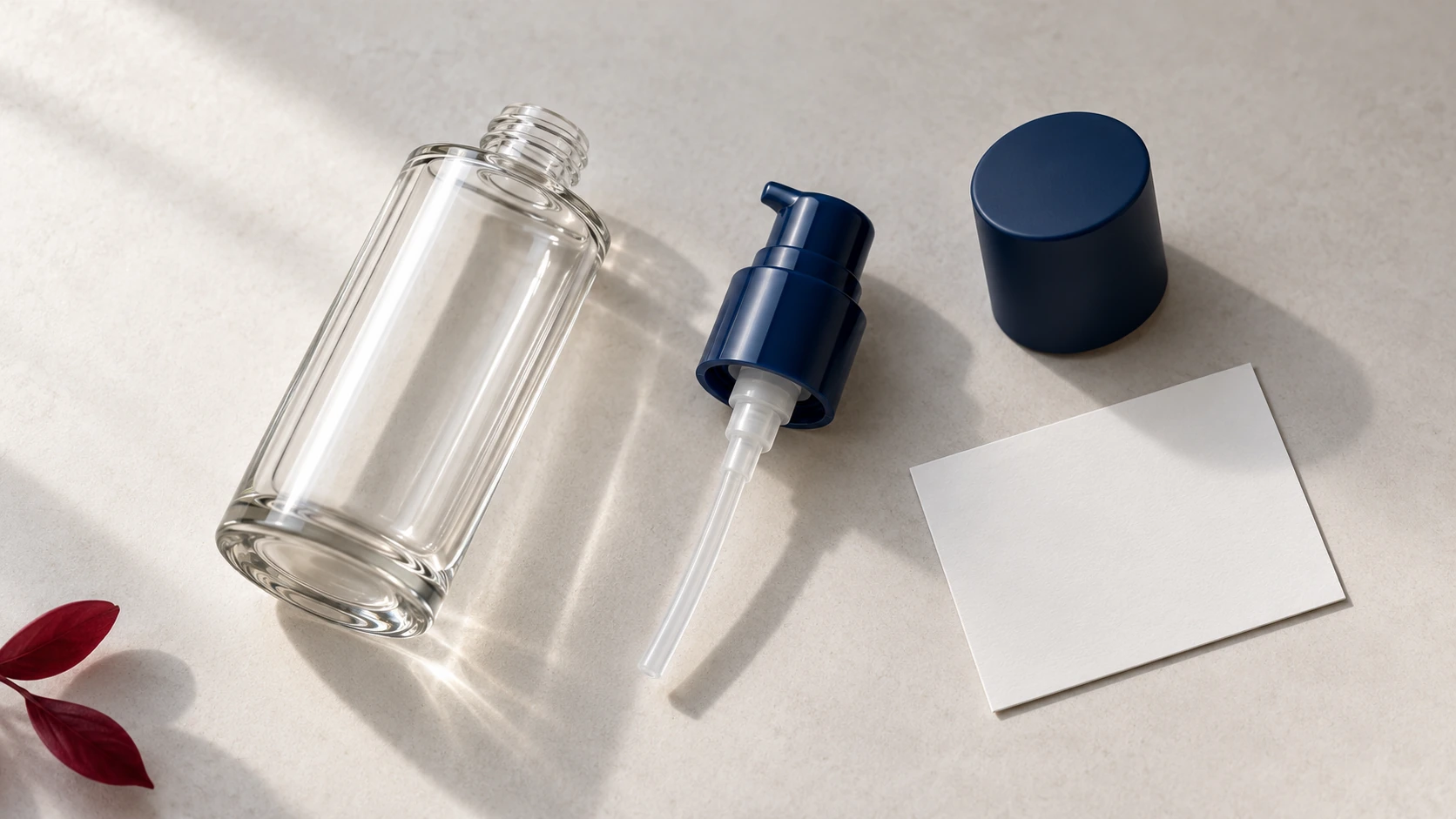 An unbranded bottle, detached pump, cap, and blank artwork card.